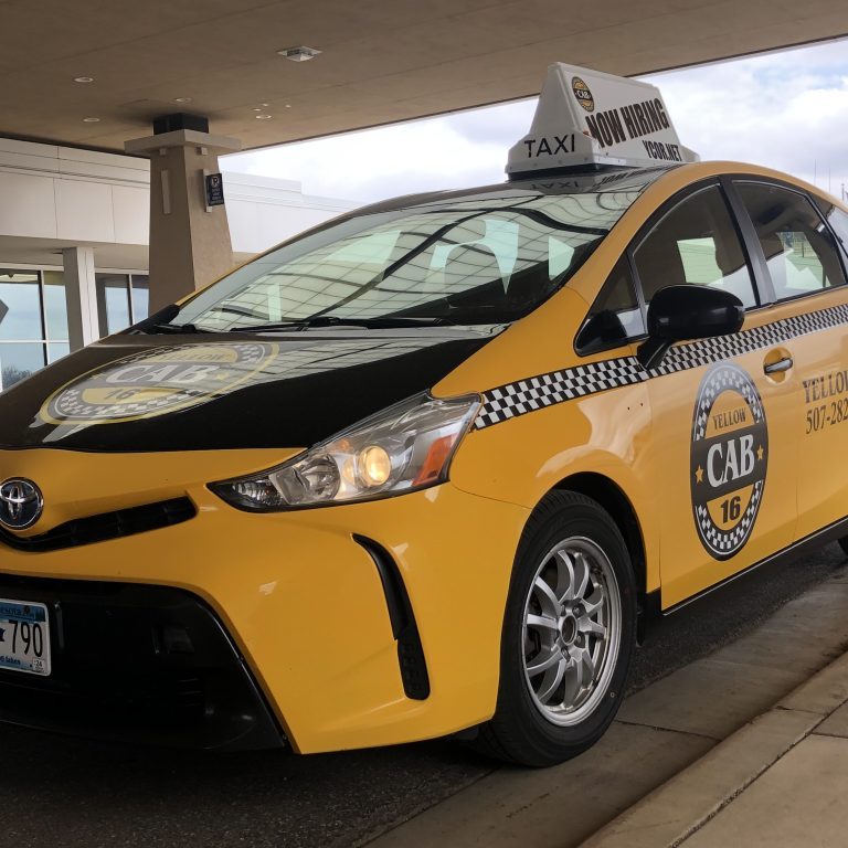 Yellow Med City Taxi cab waiting for passengers near the entrance of Rochester International Airport. (RST)